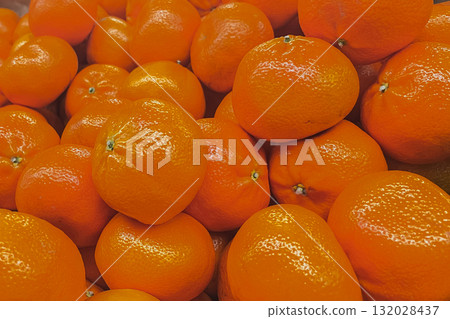 Abundance of bright orange fruits. Detailed texture of healthy, vitamin-rich mandarin or clementines 132028437