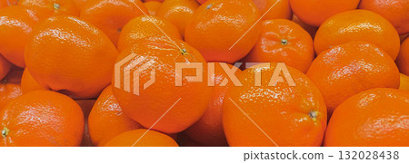 Abundance of bright orange fruits. Detailed texture of healthy, vitamin-rich mandarin or clementines Abundance of bright orange fruits. Detailed texture of healthy, vitamin-rich mandarin or clementines 132028438