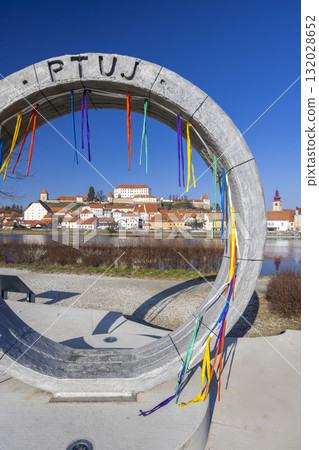 Ptuj city skyline seen through stone arch monument Ptuj city skyline seen through stone arch monument 132028652