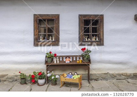 Traditional slovak house with folk dolls and windows 132028770