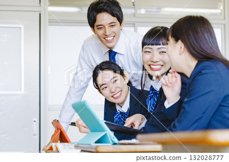 High school girl and male teacher studying in the classroom 132028777