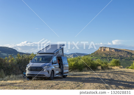 Camper van parked at Rock of Solutre, enjoying nature Camper van parked at Rock of Solutre, enjoying nature 132028831