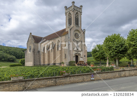 Fuisse church standing over green vineyards in Bourgogne 132028834