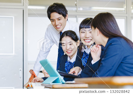 High school girl and male teacher studying in the classroom 132028842