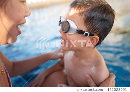 Happy Child And His Mother In Pool Embracing Joyful Connection Together 132028991