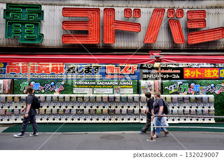 Gashapon machines lined up in front of a camera shop at Shinjuku West Exit Gashapon machines lined up in front of a camera shop at Shinjuku West Exit 132029007