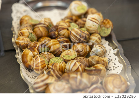 Escargot de Bourgogne serving a traditional French delicacy Escargot de Bourgogne serving a traditional French delicacy 132029280