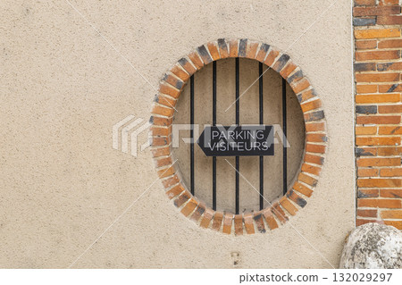 Parking visiteurs sign on Epernay wall Parking visiteurs sign on Epernay wall 132029297