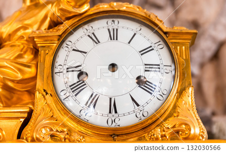 A gilded, intricately designed clock with no movement 132030566