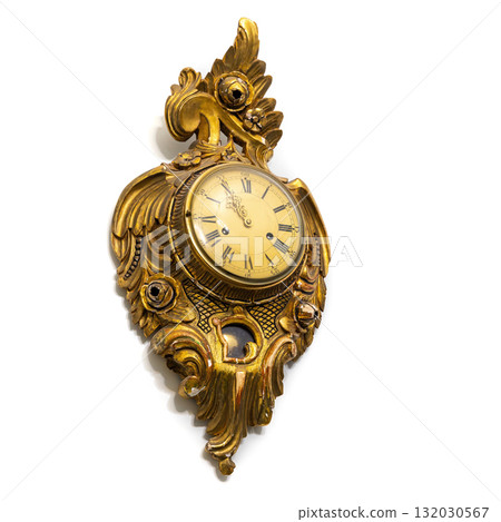 Vintage gilded clock isolated on white background featuring intricate floral carvings 132030567