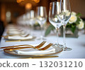beautiful table setting with flowers and cutlery on wooden table at wedding or dinner. stylish tablewear decorations 132031210