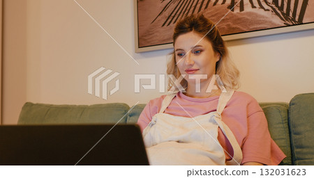 Pregnant business woman typing on laptop indoors. Pregnant business woman typing on laptop indoors. 132031623
