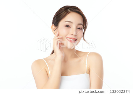 A beautiful young Asian woman with clean, fresh skin against a white background. Skincare, facial treatment, cosmetology, beauty, and spa. An elegant portrait of an Asian woman. A beautiful young Asian woman with clean, fresh skin against a white background. Skincare, facial treatment, cosmetology, beauty, and spa. An elegant portrait of an Asian woman. 132032274