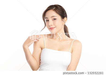 A beautiful young Asian woman with clean, fresh skin against a white background. Skincare, facial treatment, cosmetology, beauty, and spa. An elegant portrait of an Asian woman. 132032281