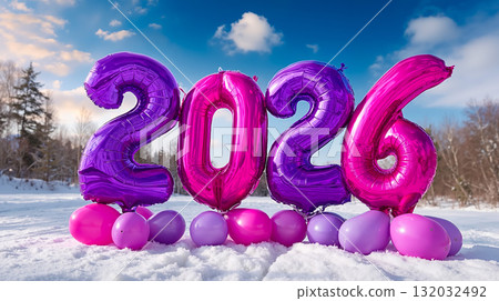 A bunch of pink and purple balloons in the snow with the number 2026 written on them A bunch of pink and purple balloons in the snow with the number 2026 written on them 132032492