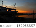 View of the sunset from the bow of a fishing boat 132033357