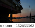 View of the sunset from the bow of a fishing boat 132033362