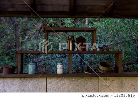 A display shelf lined with antique items 132033619