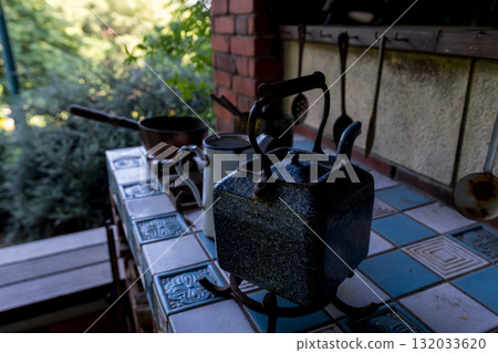 Antique kettle on a tiled counter Antique kettle on a tiled counter 132033620