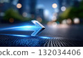 Dynamic Blue Arrow Symbolizing Progress and Speed in a Blurred Cityscape 132034406