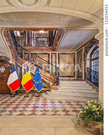 Paris, France - May 18, 2025: Hotel de Behague in Paris, which currently houses the Embassy of Romania to France. The country flags alongside the EU are displayed at the entrance 132034453