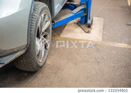 Close-up of a car rear wheel before tire replacement. Seasonal tire change for winter preparation in Czech Republic. 132034802