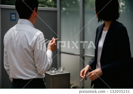 Taking a break in the smoking area 132035231