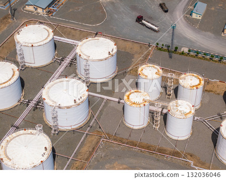 Aerial view of industrial storage tanks in petroleum facility Aerial view of industrial storage tanks in petroleum facility 132036046