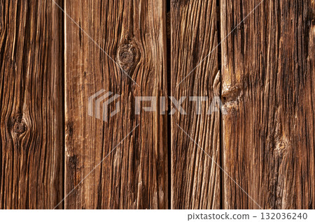 Old brown wooden panel wall texture. Antique wood floor pattern with splinters and knots 132036240
