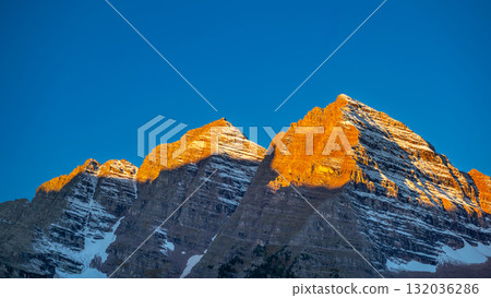 Morning light shines on the mountaintop of Maroon Bells at sunrise, Colorado, USA Morning light shines on the mountaintop of Maroon Bells at sunrise, Colorado, USA 132036286