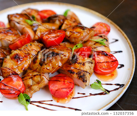 Baked chicken wings over black stone background with copy space. Top view, flat lay 132037356