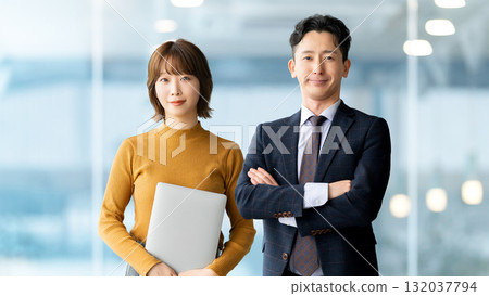 Image of business teamwork between two men and women 132037794