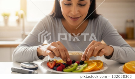 Hispanic woman preparing a healthy diabetic breakfast with fresh fruit. Blood glucose meter on the table for sugar level monitoring. Diabetes management and healthy lifestyle concept Hispanic woman preparing a healthy diabetic breakfast with fresh fruit. Blood glucose meter on the table for sugar level monitoring. Diabetes management and healthy lifestyle concept 132038363