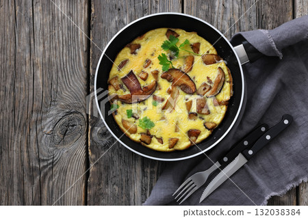 tasty porcini mushroom parmesan omelette, top view tasty porcini mushroom parmesan omelette, top view 132038384