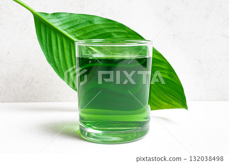 Liquid Chlorophyll Drink. Glass of Green Chrorophyll Water. 132038498