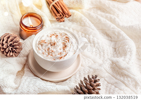 Cozy winter or Christmas template with coffee (Eggnog Latte) and candle Cozy winter or Christmas template with coffee (Eggnog Latte) and candle 132038519