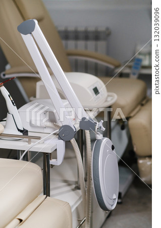 Equipment setup for a relaxing spa treatment in a serene wellness center during daylight hours 132039096