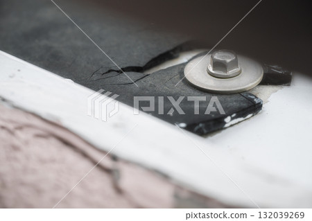 Deteriorated rubber and metal bolt joint | Aging and material texture Deteriorated rubber and metal bolt joint | Aging and material texture 132039269