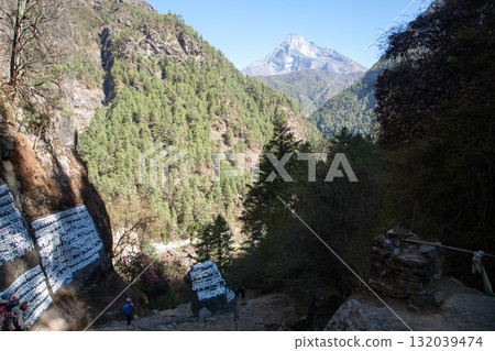 Rocks painted with prayers along EBC trek, Nepal 132039474