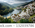 Close-up of White Blossoms with a Scenic Valley and Lake in Background 132039786