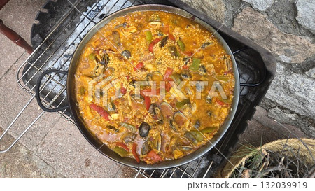 Traditional spanish paella with seafood and vegetables for culinary exploration. Typical cuisine of Spain. Valencian cuisine. Stage of cooking paella. Ingredients for paella 132039919