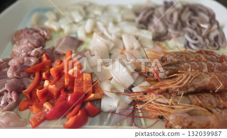 Fresh ingredients for authentic spanish paella dish preparation. Typical cuisine of Spain. Valencian cuisine. Stage of cooking paella. Ingredients for paella Fresh ingredients for authentic spanish paella dish preparation. Typical cuisine of Spain. Valencian cuisine. Stage of cooking paella. Ingredients for paella 132039987