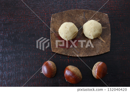 Kuri-kinton on a plate placed on a lacquered board 132040420