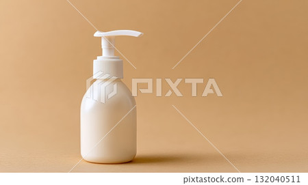 White Lotion Bottle With Pump On Neutral Beige Background For Skincare And Self-Care Imagery 132040511