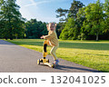 Scooter outdoor. Child play park nature. Toddler balance wheels road. 132041025