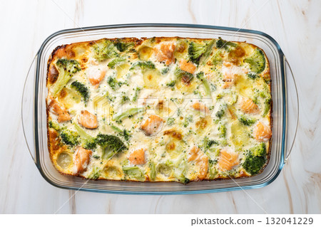 Salmon and broccoli gratin with melted mozzarella cheese Salmon and broccoli gratin with melted mozzarella cheese 132041229