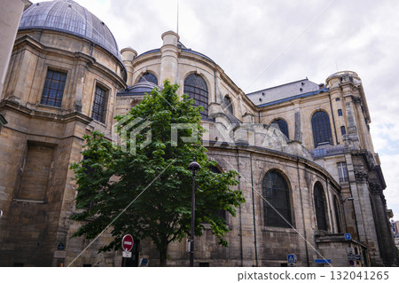 Historic stone church with domes and arched windows in Paris Historic stone church with domes and arched windows in Paris 132041265