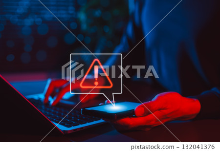 Mobile Security Alert and Cyber Threat Notification. Man holding smartphone with red warning sign and exclamation mark, symbolizing secure, system errors, hacking alerts, and online data protection. Mobile Security Alert and Cyber Threat Notification. Man holding smartphone with red warning sign and exclamation mark, symbolizing secure, system errors, hacking alerts, and online data protection. 132041376