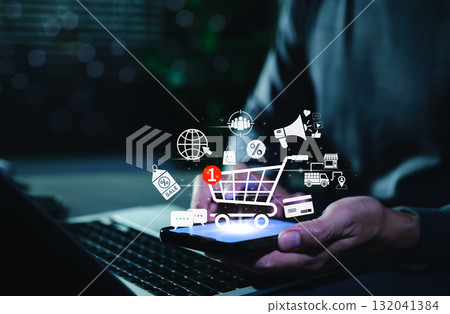 Online Shopping and E-commerce Technology Concept. Digital shopping cart with icons of sale, discount, delivery, payment, marketing, symbolizing online shopping, e-commerce, modern retail technology Online Shopping and E-commerce Technology Concept. Digital shopping cart with icons of sale, discount, delivery, payment, marketing, symbolizing online shopping, e-commerce, modern retail technology 132041384