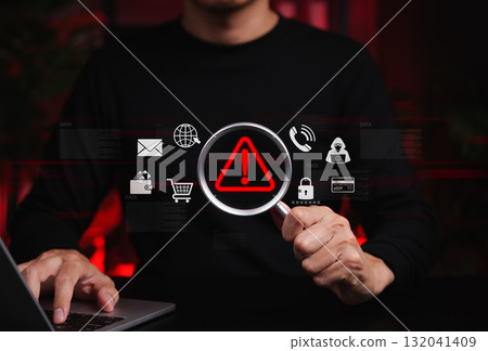 Online Scam Alert and Fraud Detection Concept. Person holds magnifying glass focusing on red warning symbol, online scam detection, cyber fraud risk, scammer, suspicious threat, data security concerns Online Scam Alert and Fraud Detection Concept. Person holds magnifying glass focusing on red warning symbol, online scam detection, cyber fraud risk, scammer, suspicious threat, data security concerns 132041409